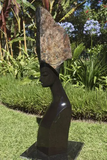 Outdoor Shona sculpture of a lady Serena by Zimbabwean artist Tutani Mgabazi