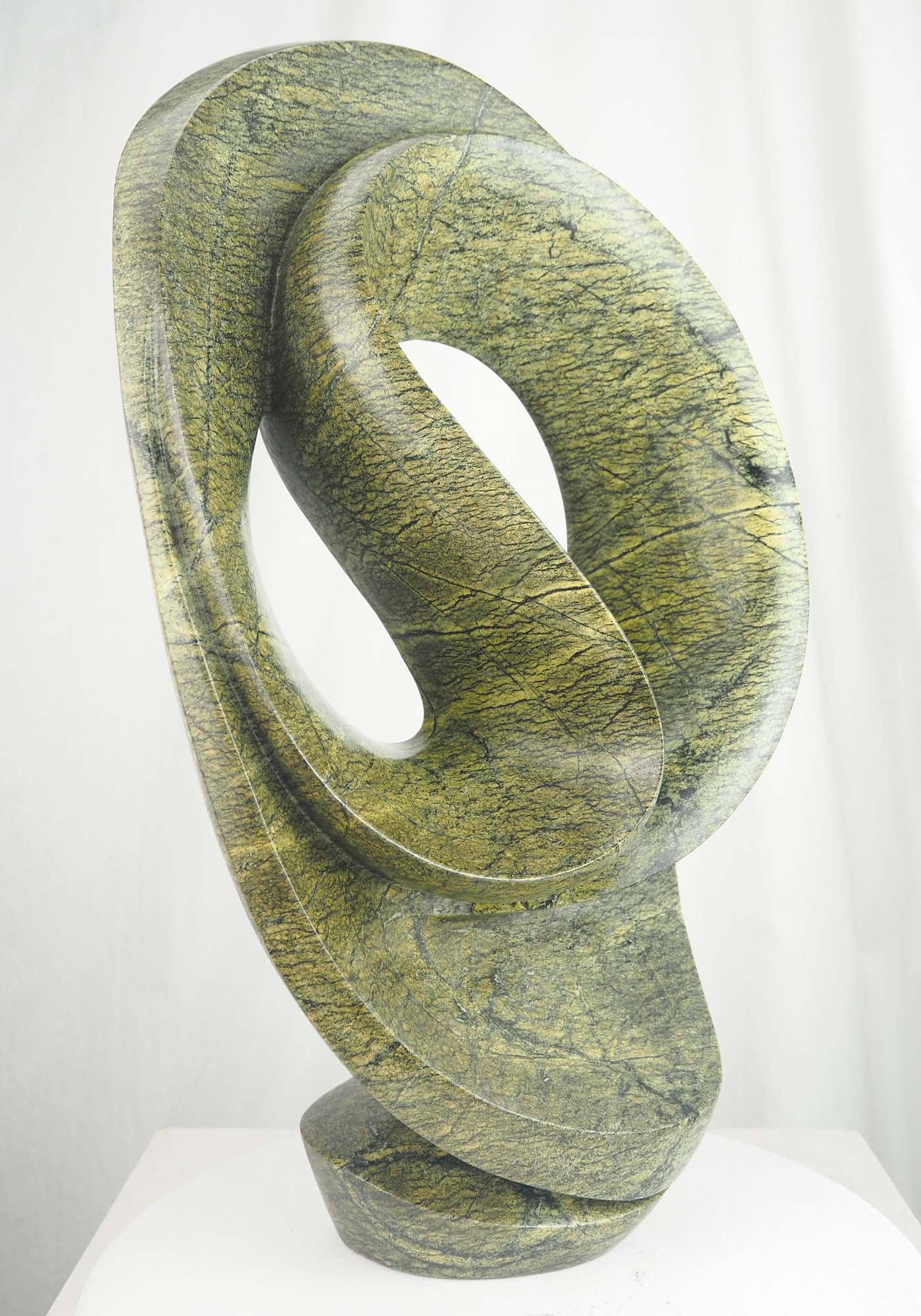 Abstract green stone Zimbabwean sculpture Skipping Rope by Willard Bopoto - front left