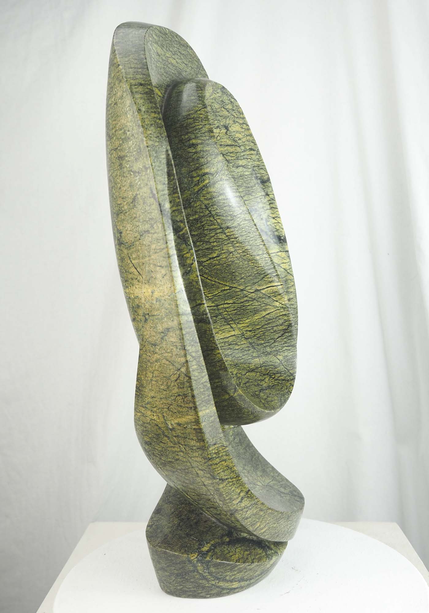Abstract green stone Zimbabwean sculpture Skipping Rope by Willard Bopoto - left side