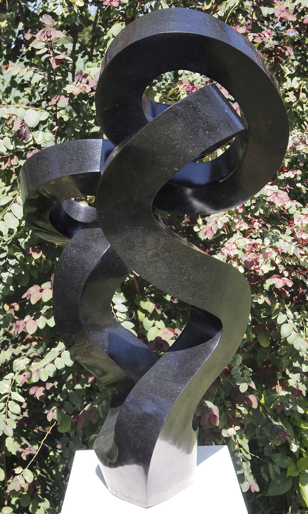 Original affordable stone sculpture - Water Lily by Charles Kowo - back right