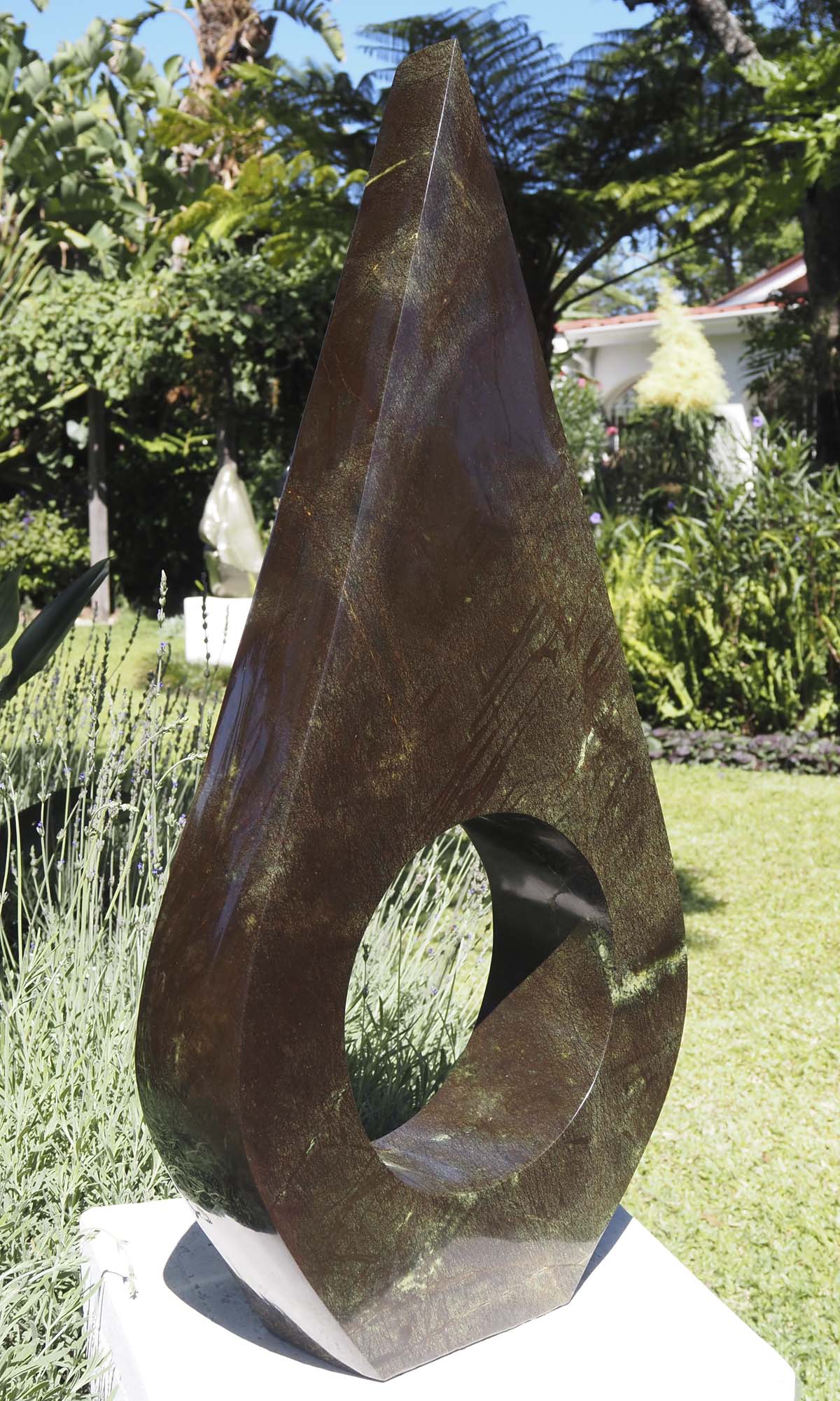 Contemporary African art sculpture - United Marriage by Nesbert Mukomberanwa - side 2 from left