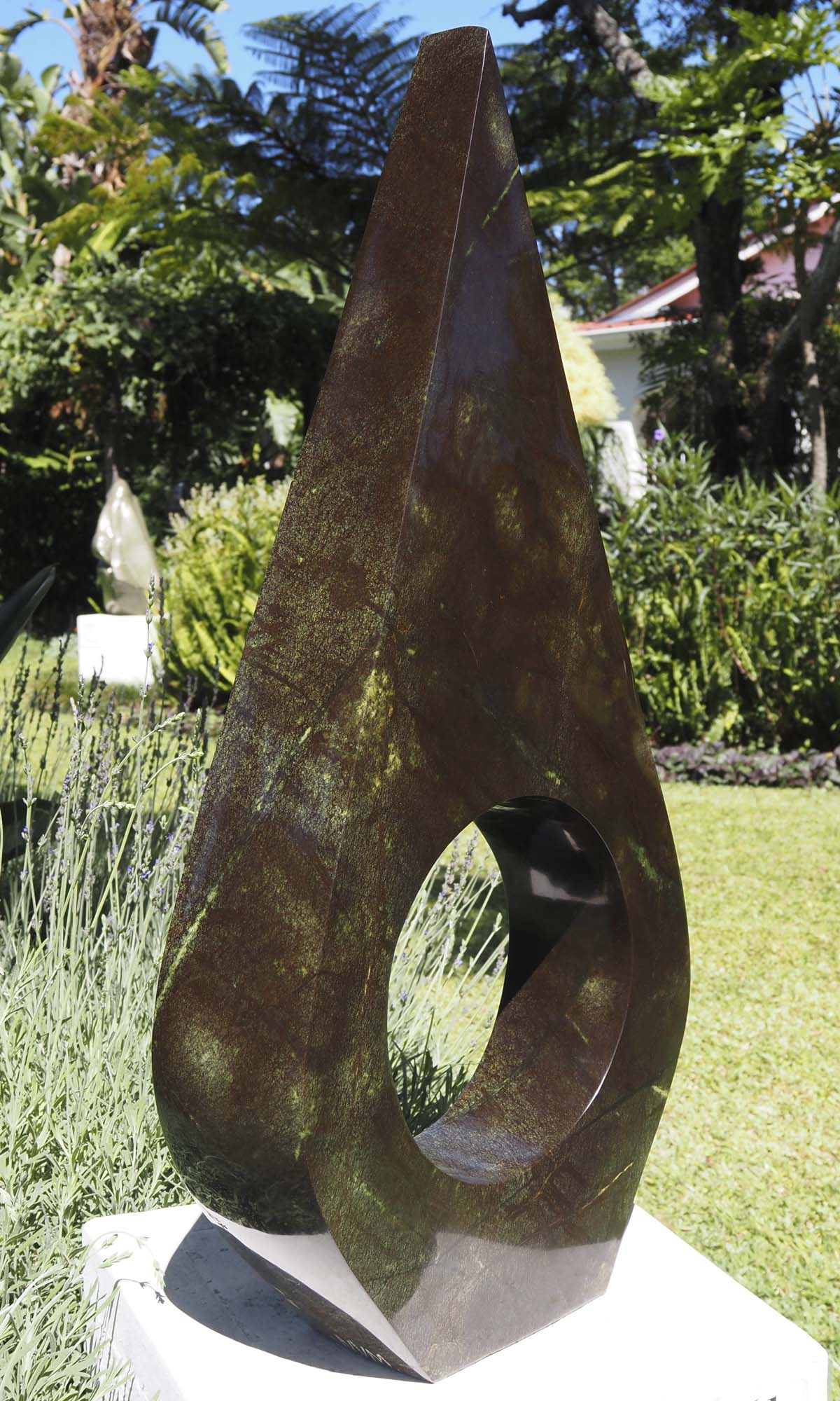 Contemporary African art sculpture - United Marriage by Nesbert Mukomberanwa - side 1 from left