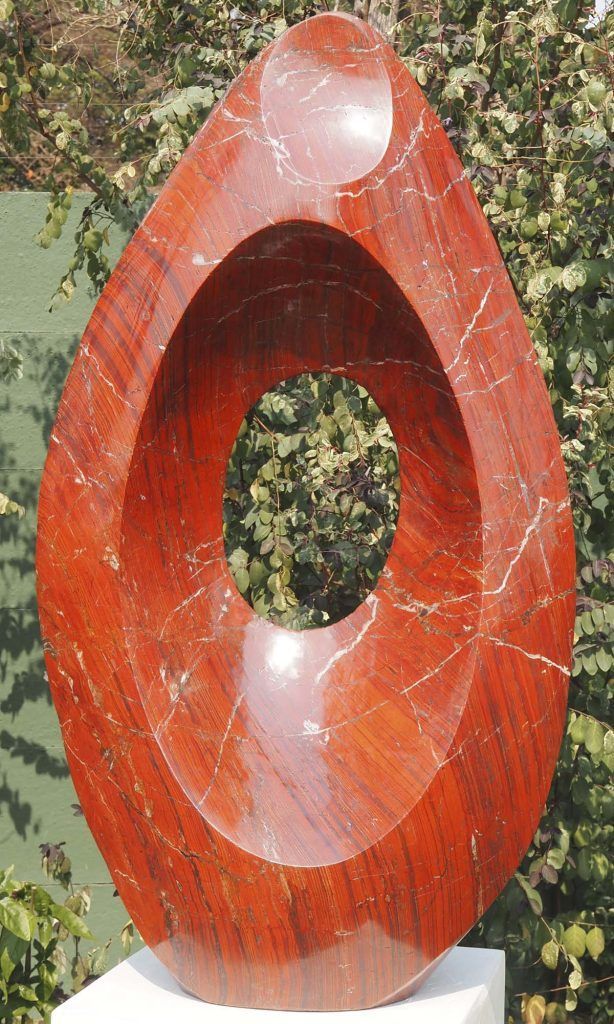 Oval semi-precious stone garden sculpture in red jasper - Mountain Echo by Tendai Gwaravaza - main image