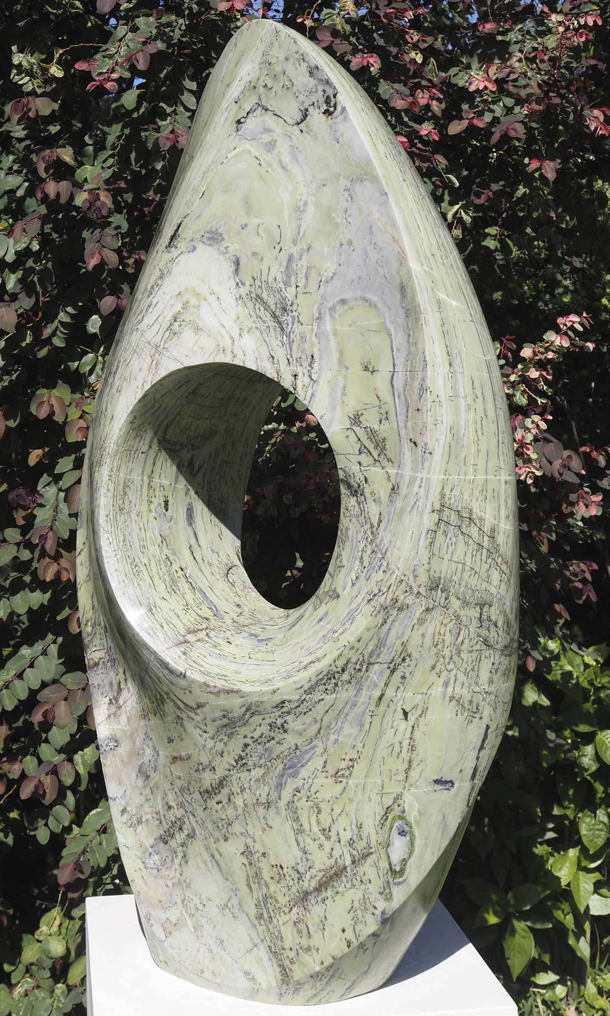 Round pale light outdoor garden sculpture - Soul Searching by Tendai Gwaravaza - front right