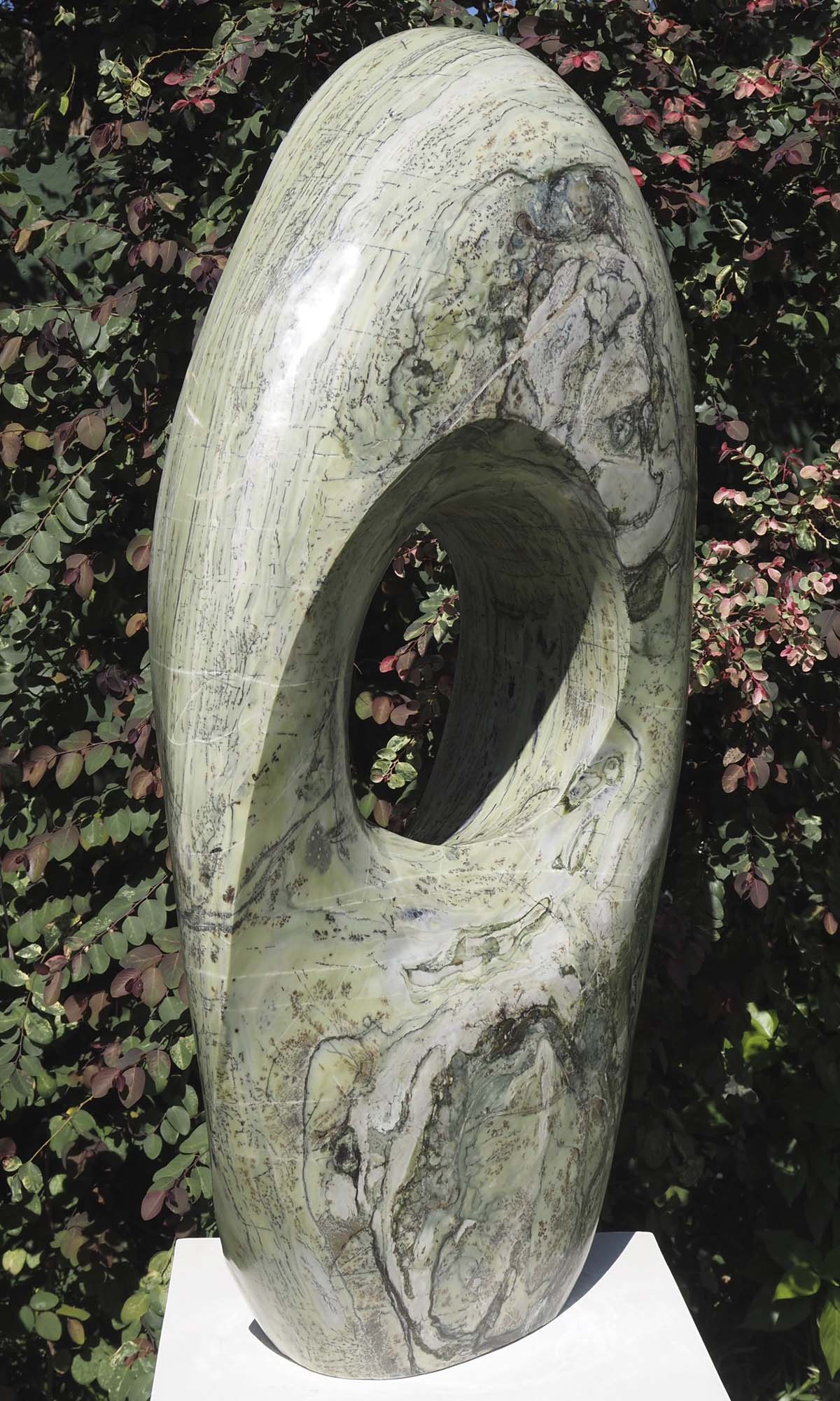 Round pale light outdoor garden sculpture - Soul Searching by Tendai Gwaravaza - back left