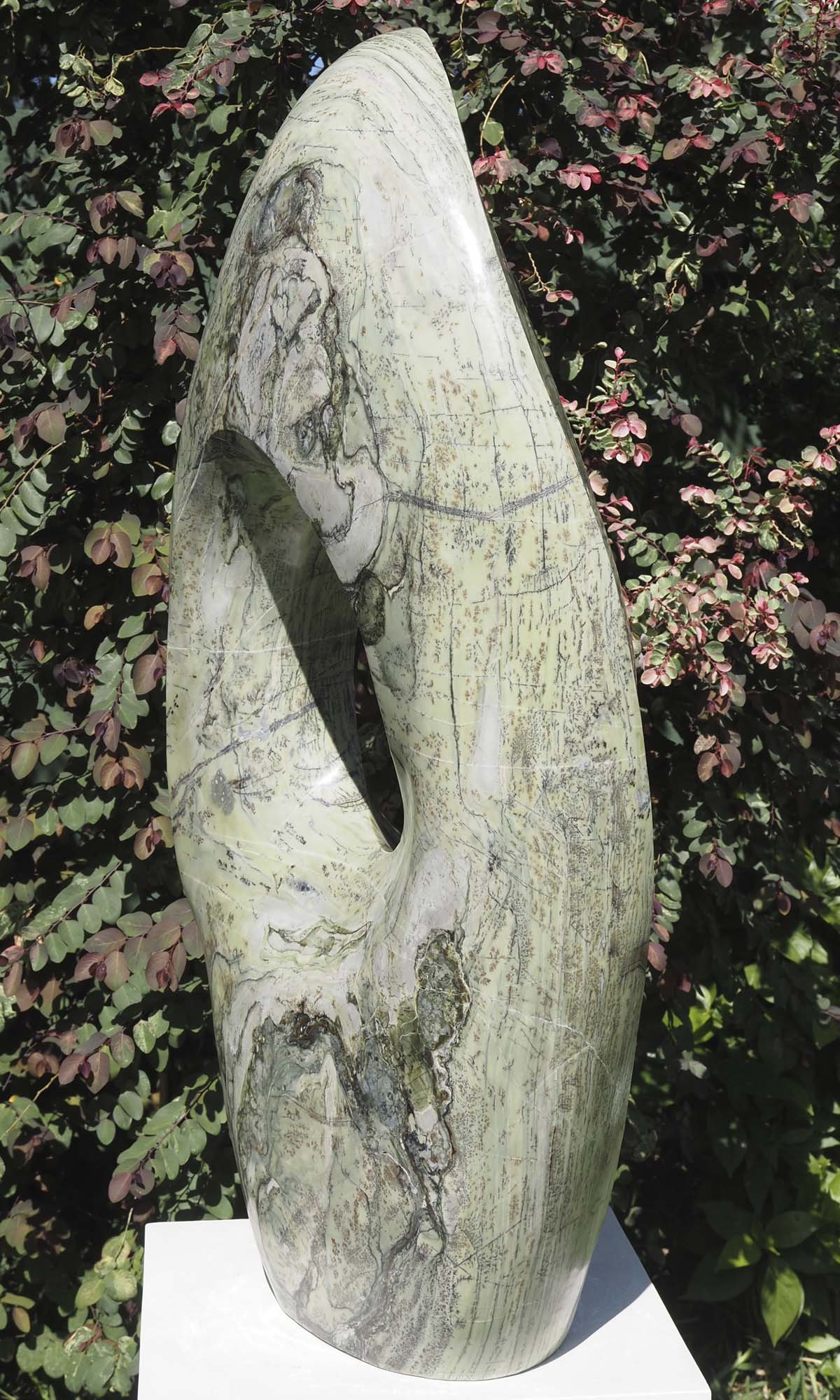 Round pale light outdoor garden sculpture - Soul Searching by Tendai Gwaravaza - back right