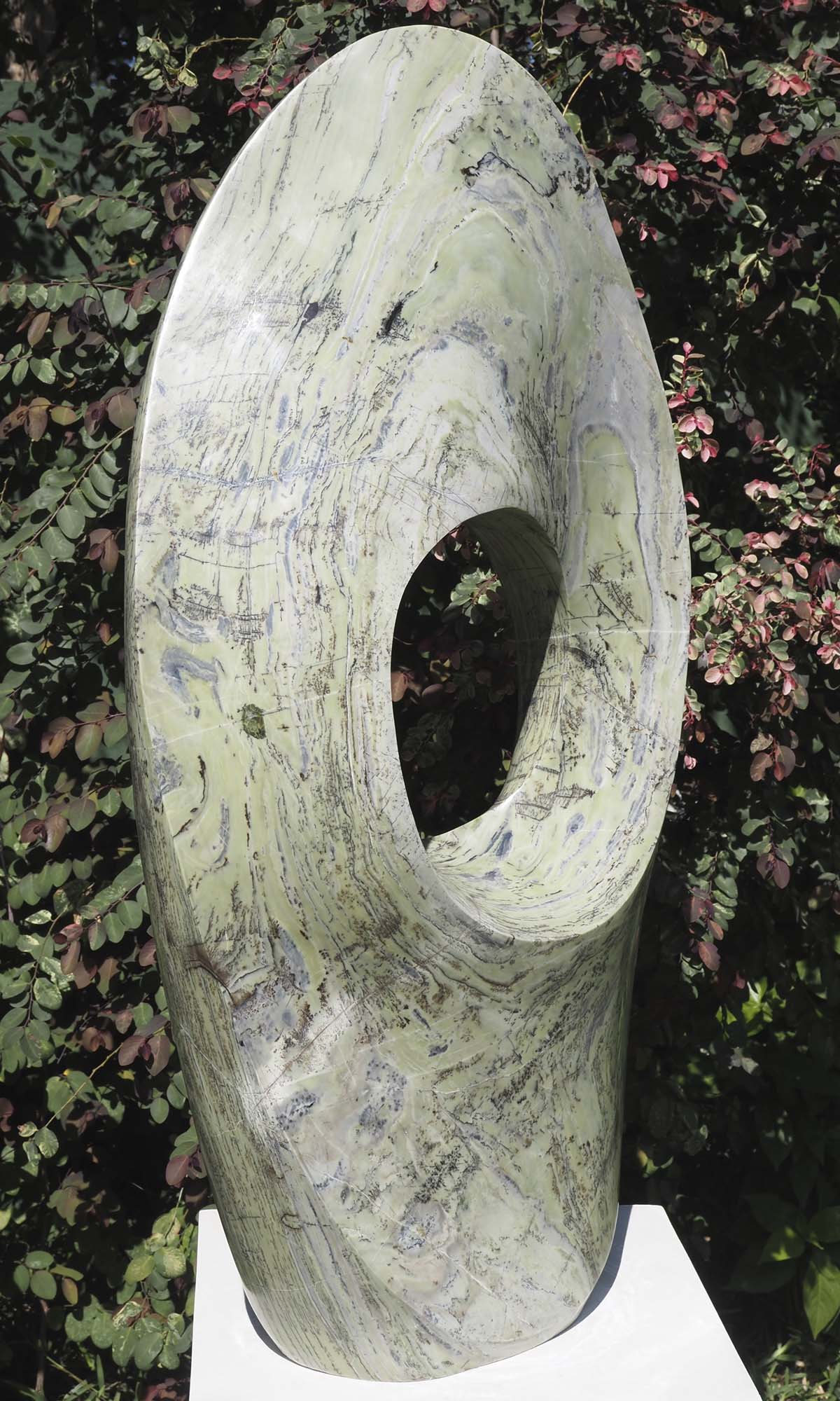 Round pale light outdoor garden sculpture - Soul Searching by Tendai Gwaravaza - front left