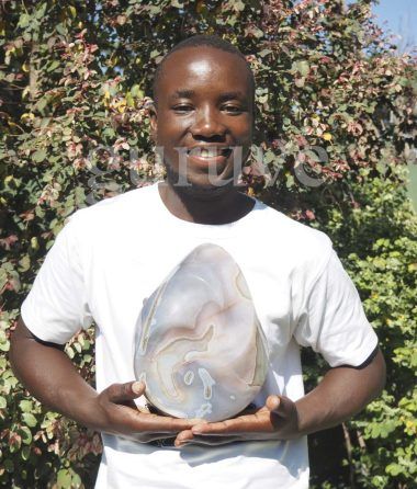 Young sculptor Michael Gwaravaza from Zimbabwe's Shona Sculpture movement