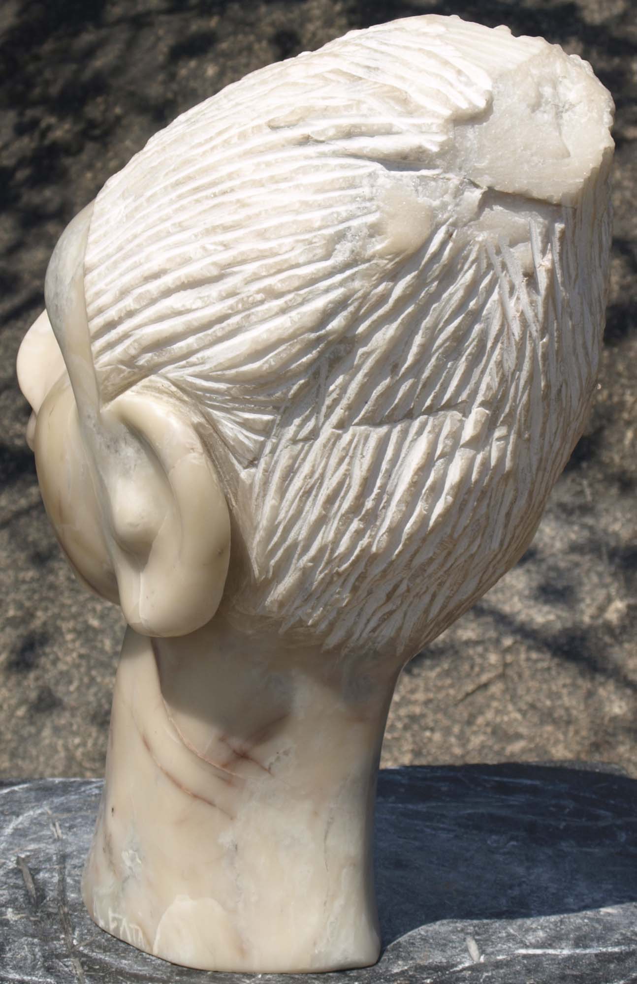 Marble sculpture stone head - Portrait Of Tendai by Zimbabwean artist Arthur Fata - back left