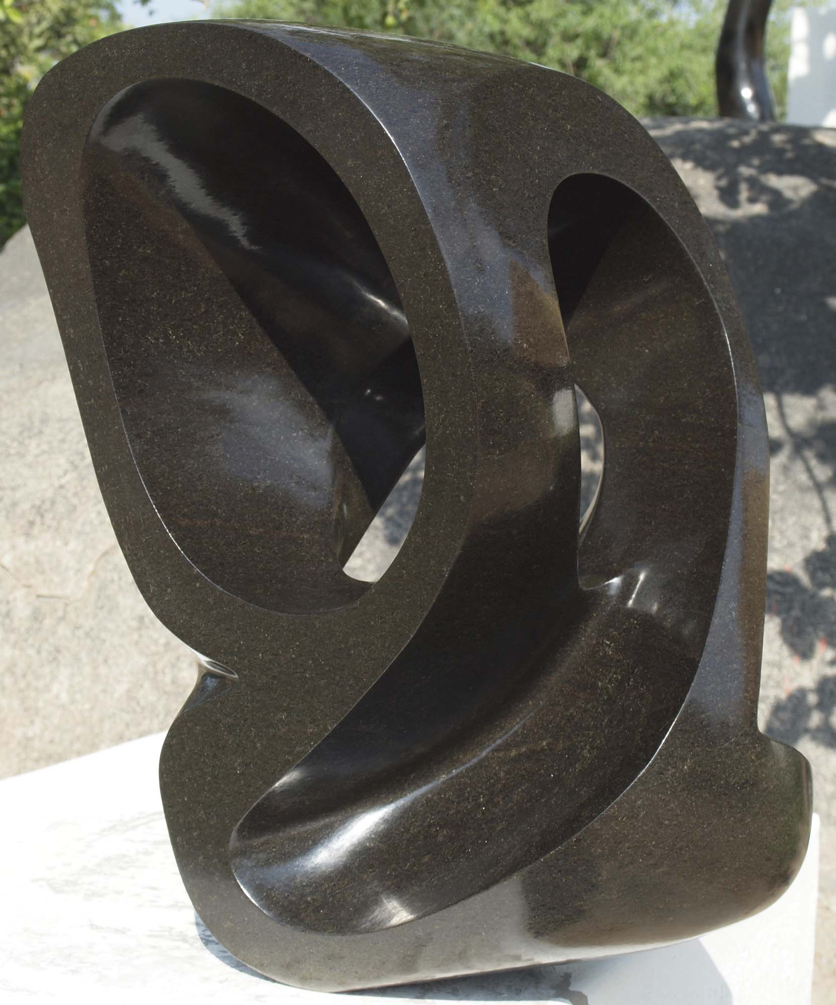 Contemporary stone sculpture - Mediator by African artist Munyaradzi Jeche - front right