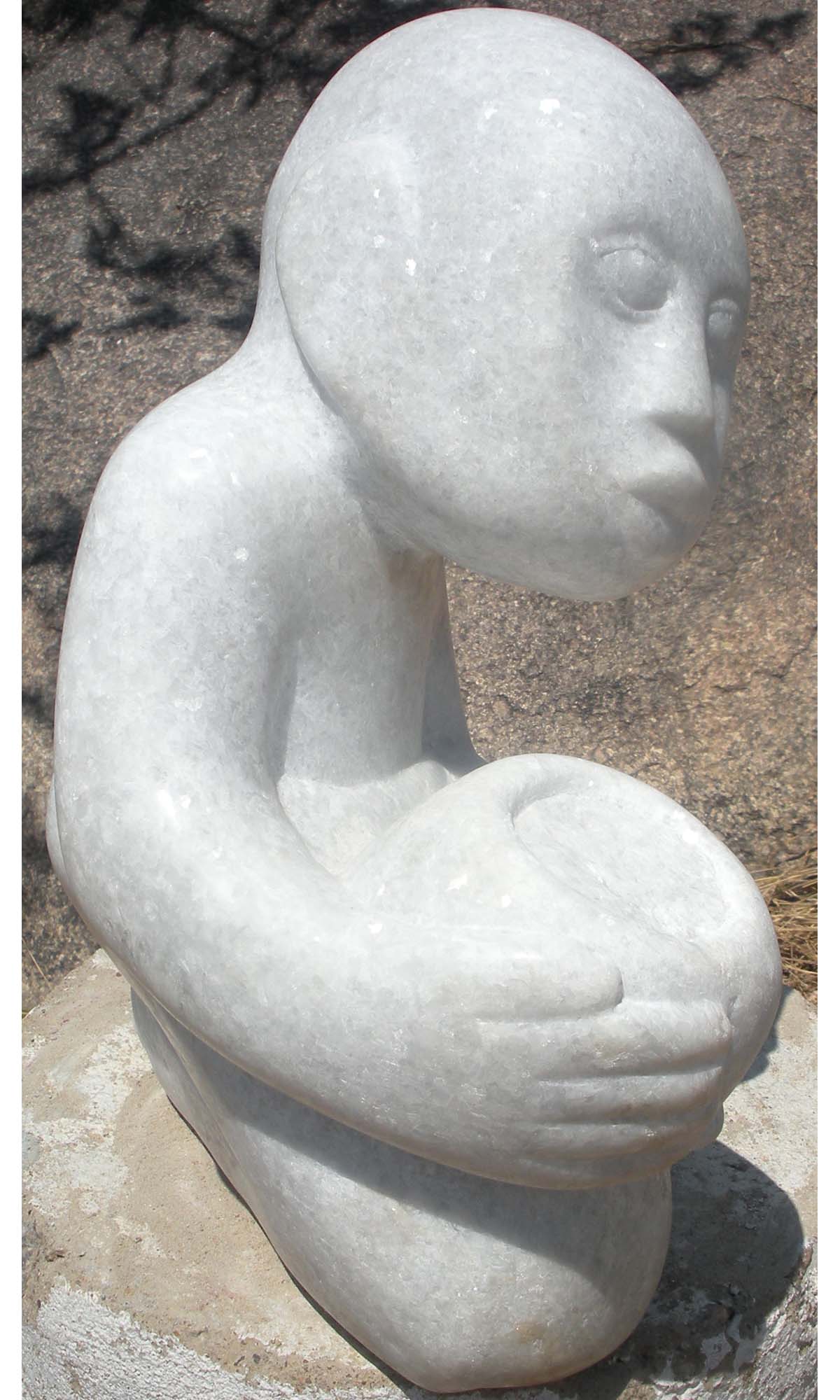 White marble Shona sculpture 'Bring You Some Food' by artist Sylvester Mubayi - front left