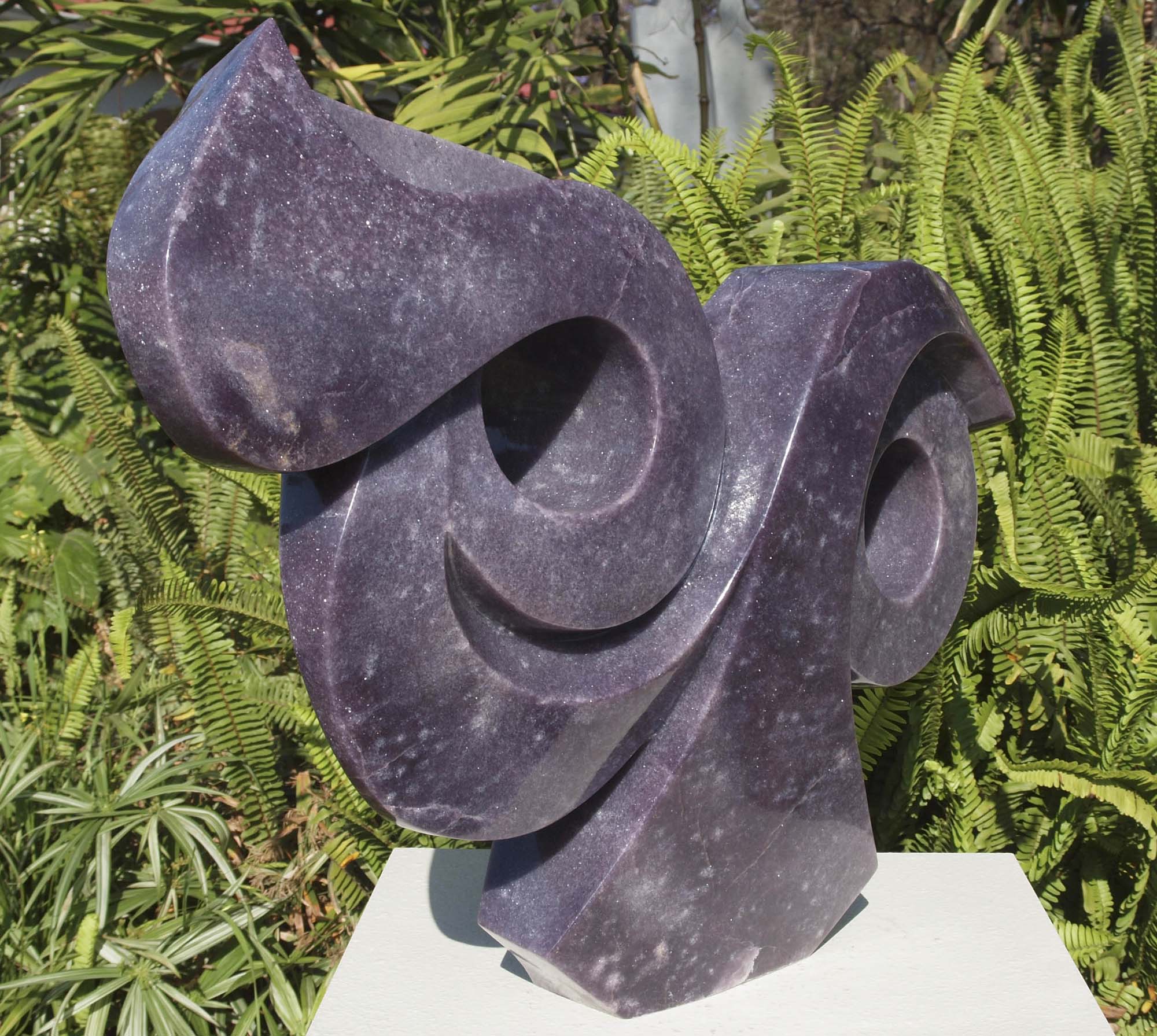 Purple stone abstract sculpture carved carving - Cat's Eyes in lepidolite by Ishmael Chitiyo from Zimbabwe - front left