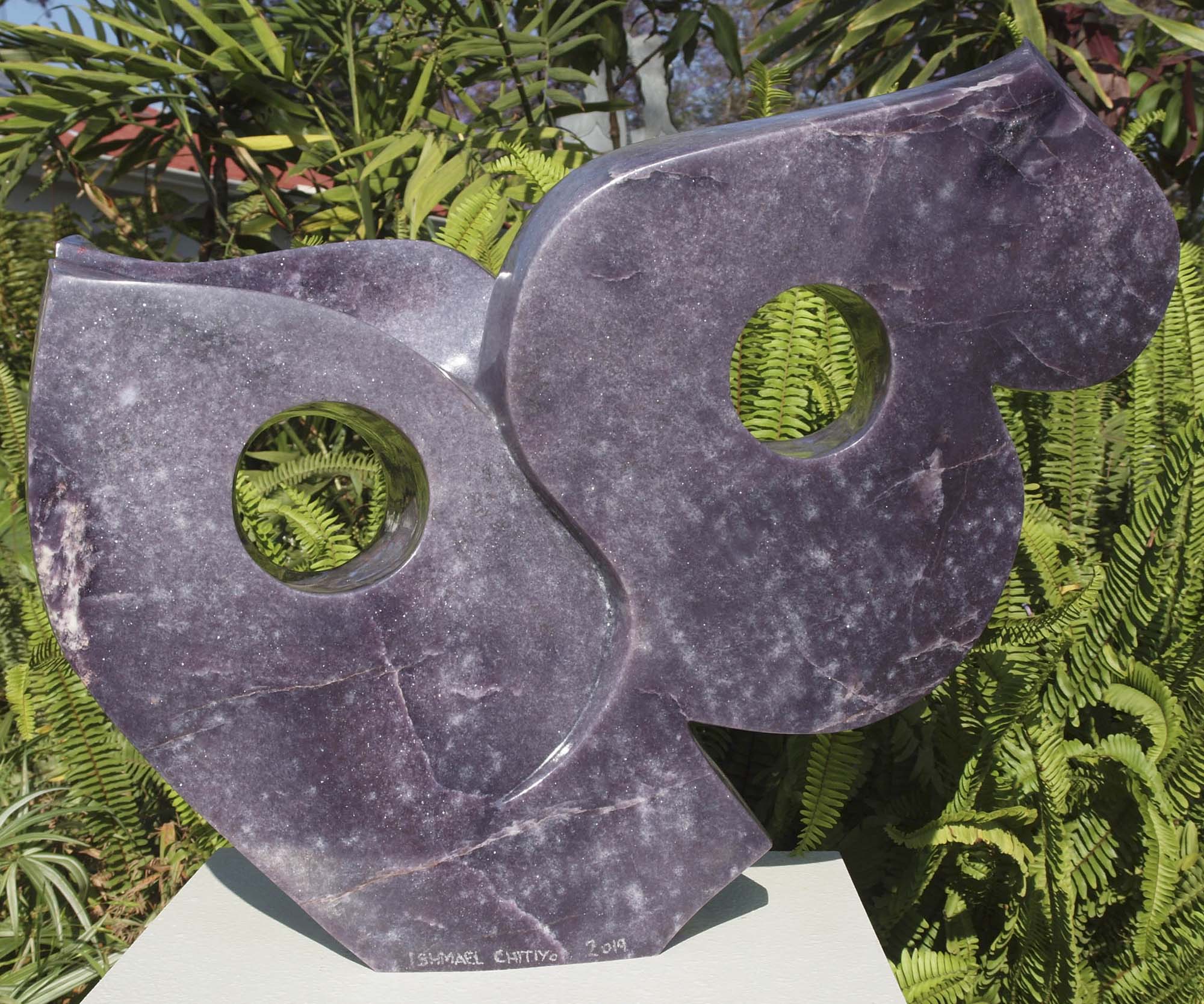 Purple stone abstract sculpture carved carving - Cat's Eyes in lepidolite by Ishmael Chitiyo from Zimbabwe - back