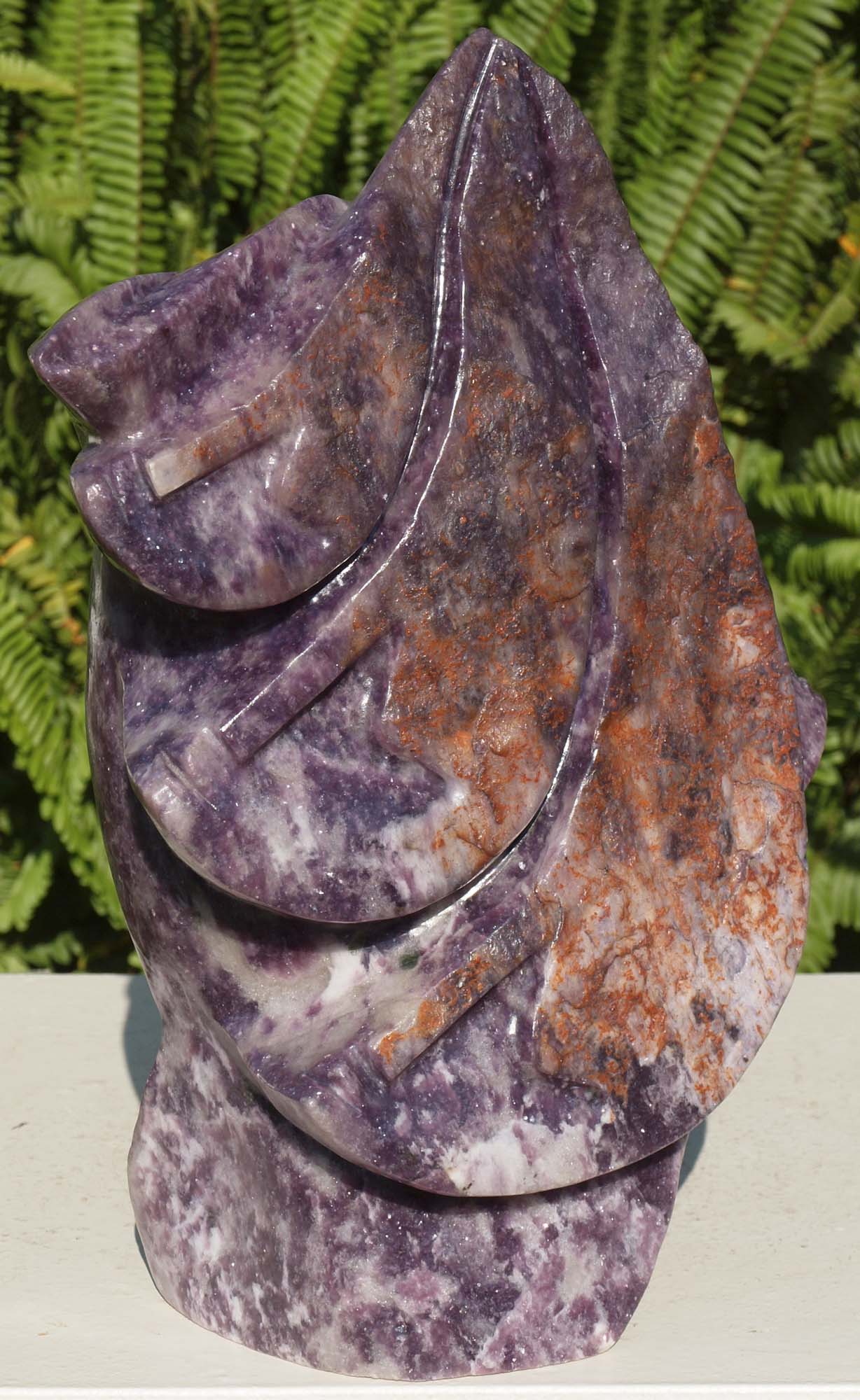 Purple stone African carving - Going On A Journey by Richard Mupumha - front left