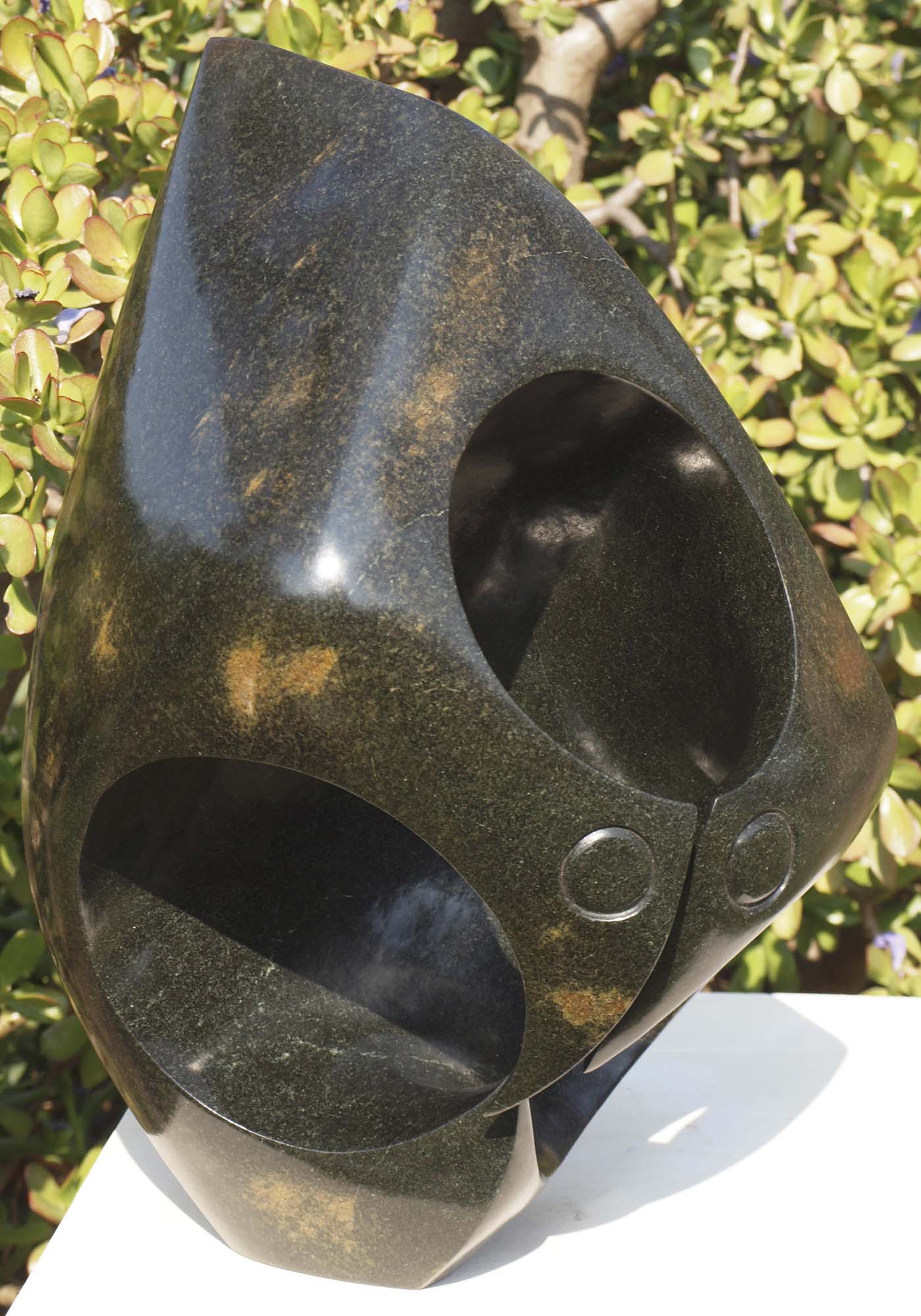 Abstract bird Zimbabwe stone sculpture - Listening Birds by Nesbert Mukomberanwa - front left