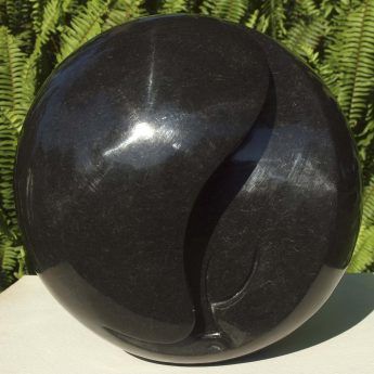 Round head black stone sculpture - 'Hiding My Face' by famous artist Nesbert Mukomberanwa from Zimbabwe - main image