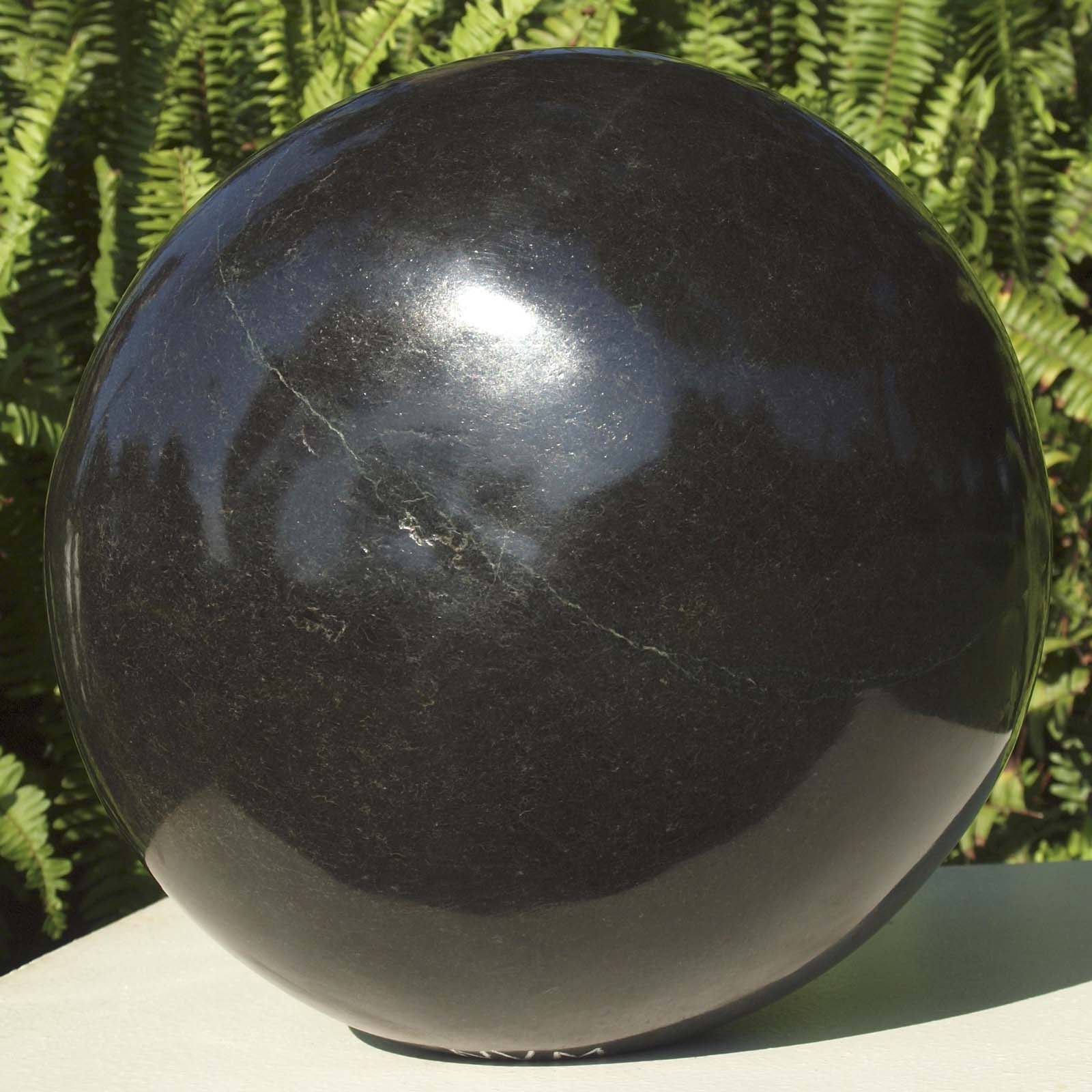 Round head black stone sculpture - 'Hiding My Face' by famous artist Nesbert Mukomberanwa from Zimbabwe - back