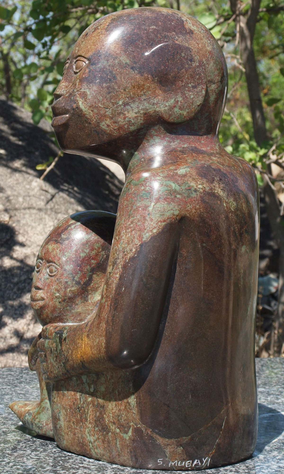 Stone sculpture of children - 'What Shall We Do?' by Sylvester Mubayi - back left
