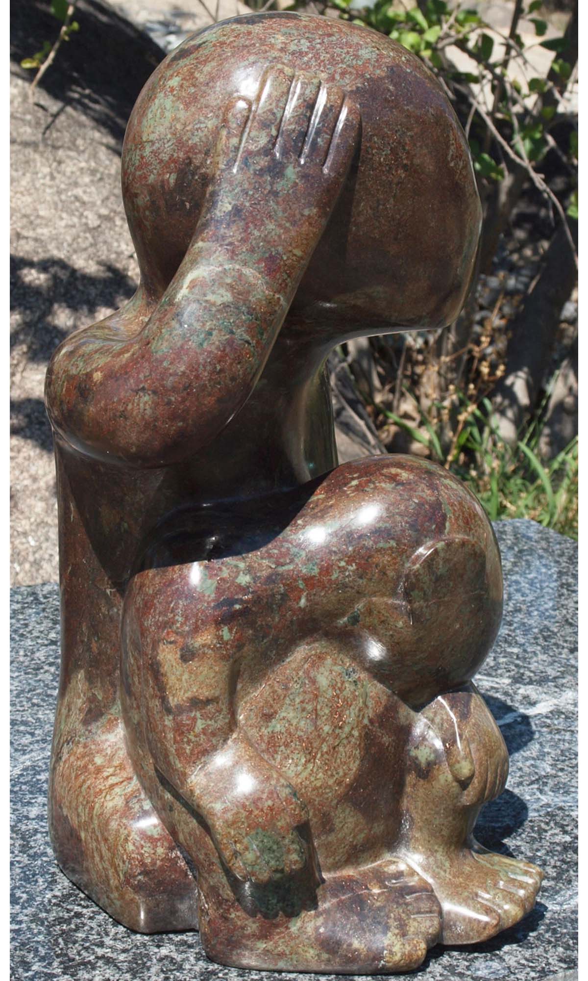 Stone sculpture of children - 'What Shall We Do?' by Sylvester Mubayi - front left