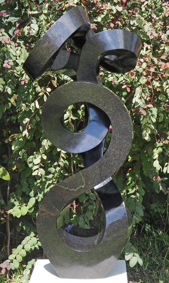 Unique UK stone garden sculpture centrepiece - Caring Mother by Charles Kowo - front