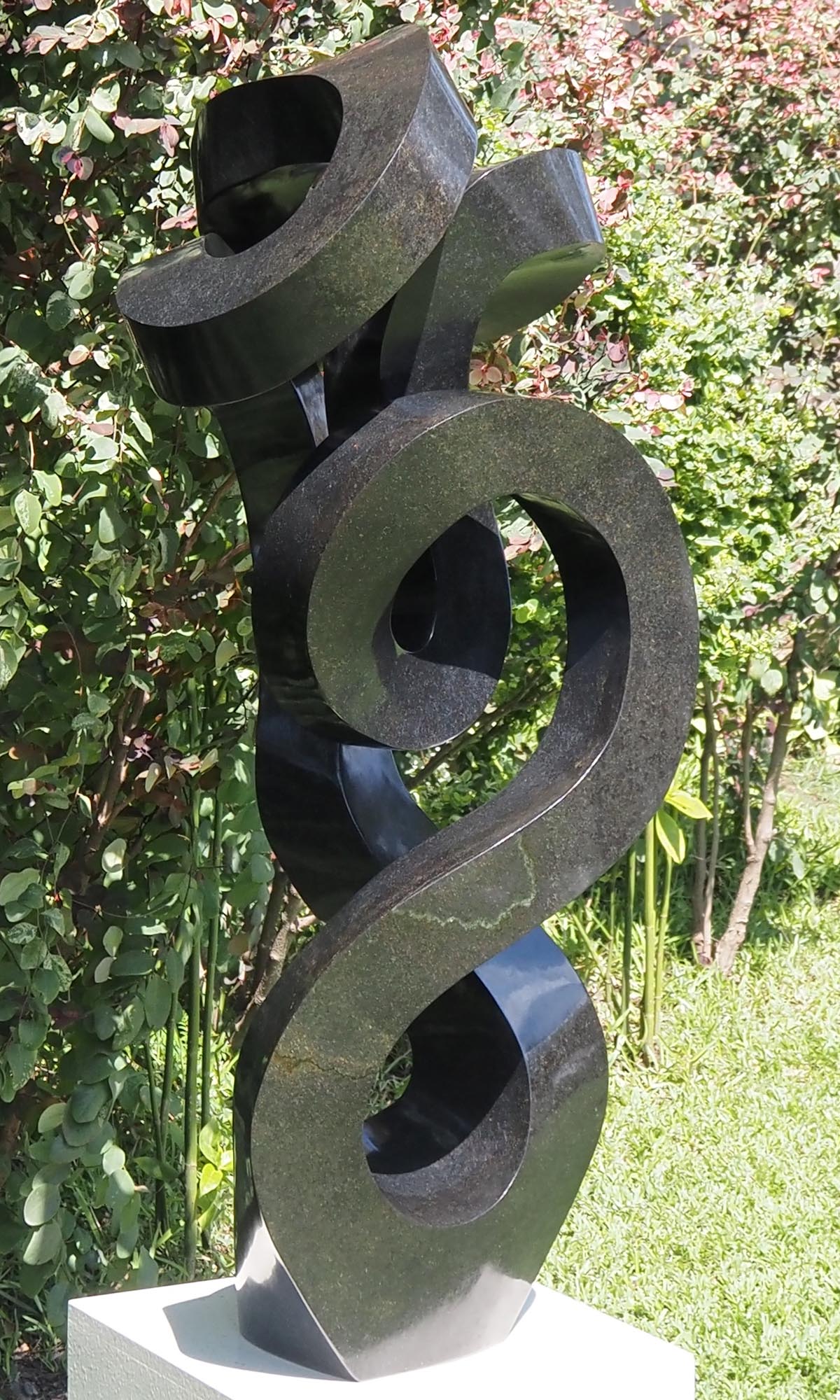 Unique UK stone garden sculpture centrepiece - Caring Mother by Charles Kowo - front left