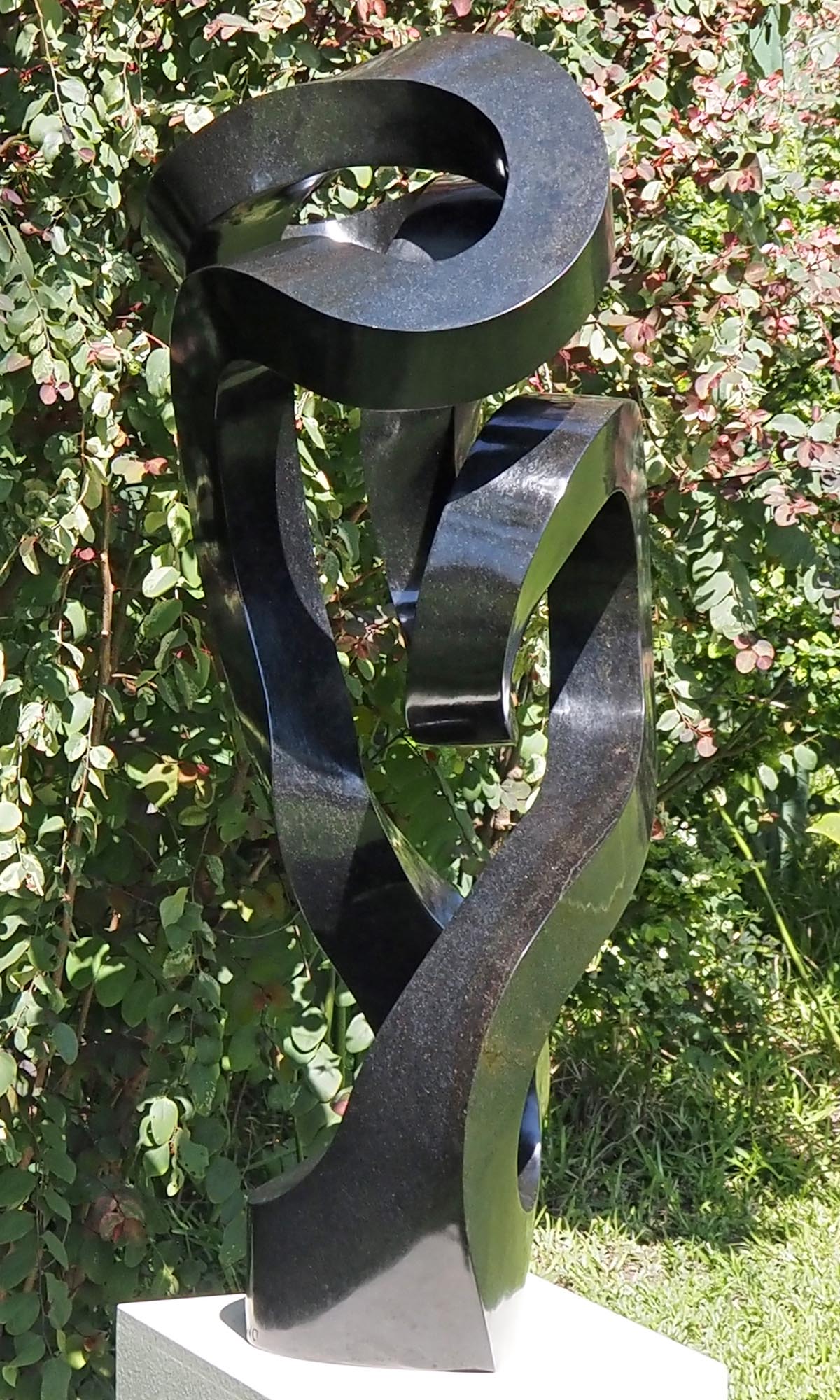 Unique UK stone garden sculpture centrepiece - Caring Mother by Charles Kowo - left side