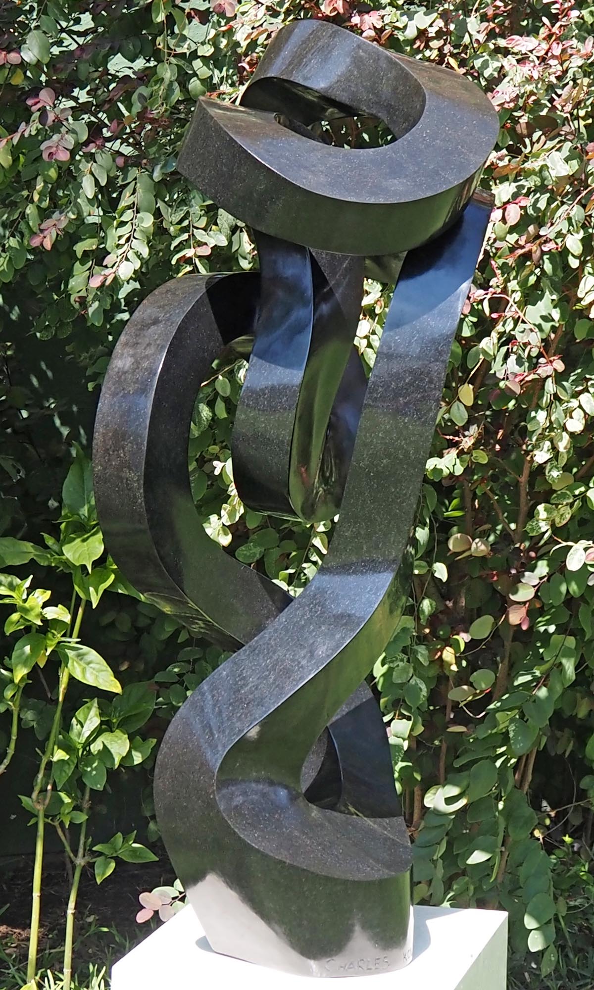 Unique UK stone garden sculpture centrepiece - Caring Mother by Charles Kowo - back left