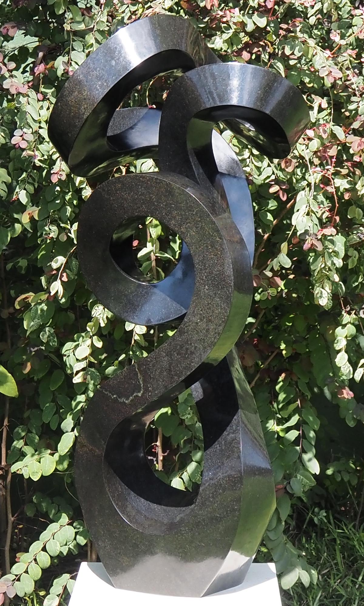 Unique UK stone garden sculpture centrepiece - Caring Mother by Charles Kowo - front right