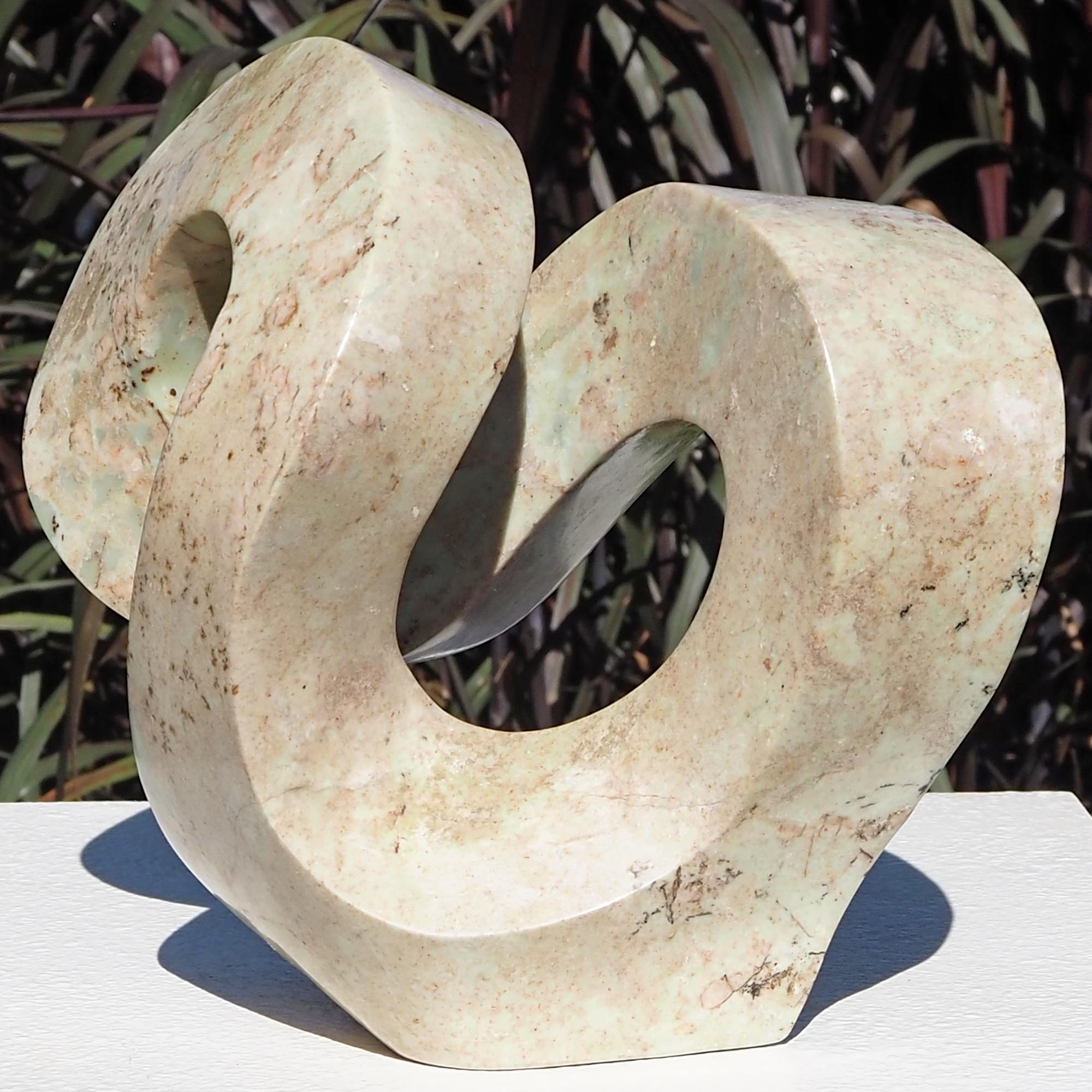 Pink stone stone sculpture original carving - Follow Me by Charles Kowo - front right
