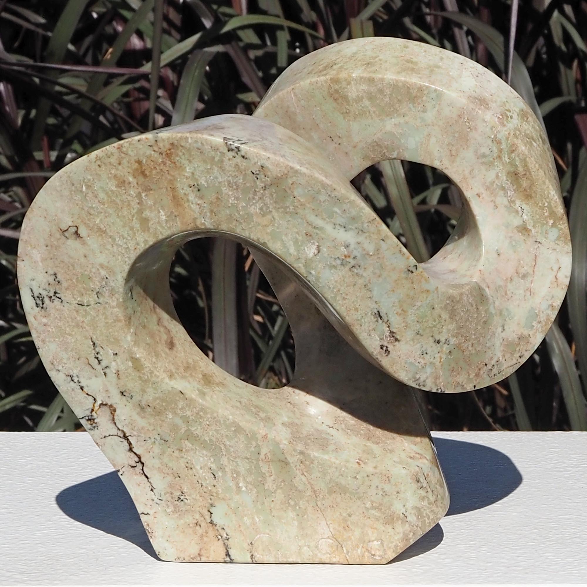 Pink stone stone sculpture original carving - Follow Me by Charles Kowo - back