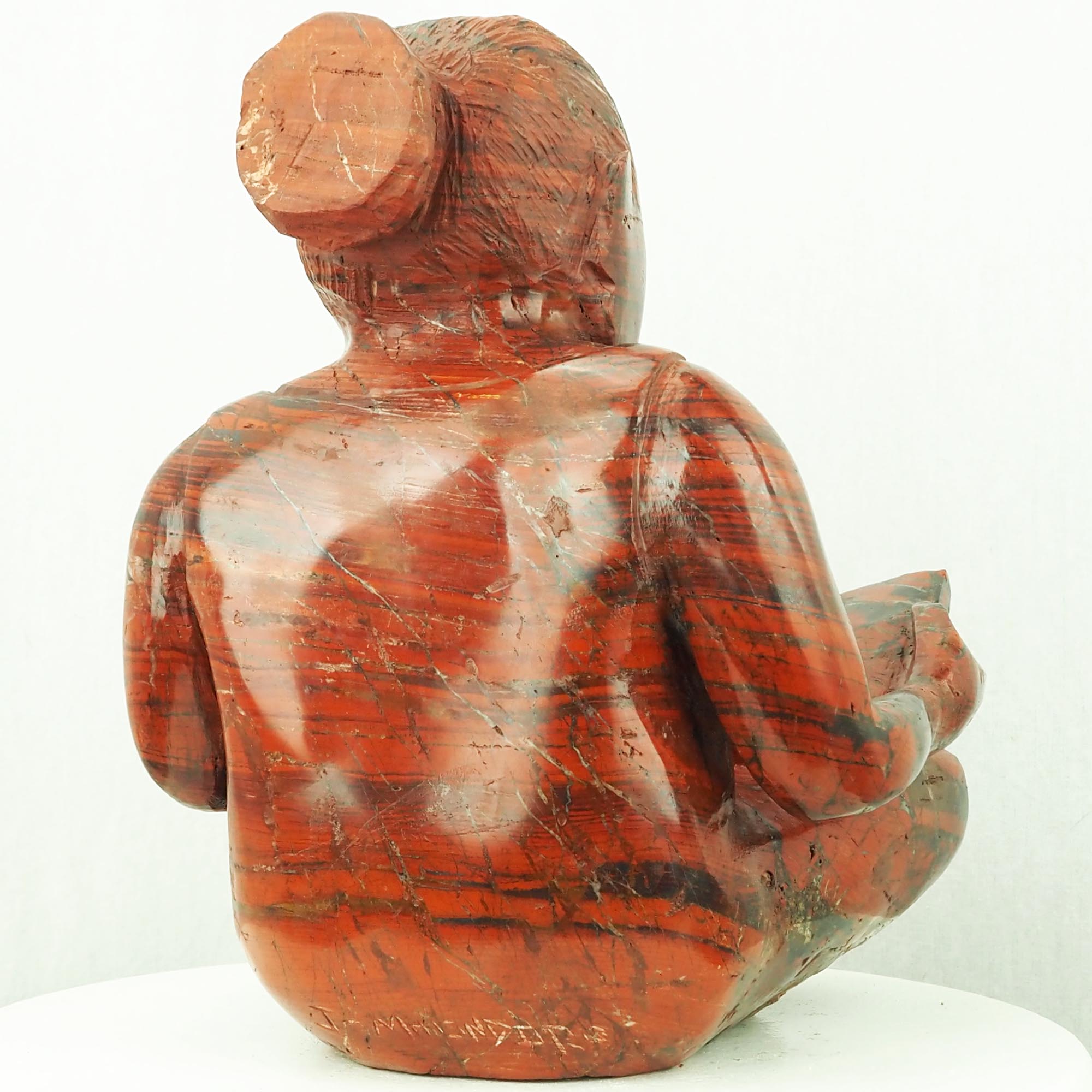 Sculpture child girl reading red stone - Doing My Homework by Jonathan Mhondorohuma - back