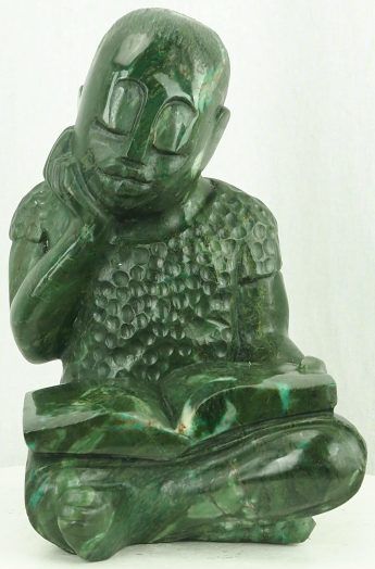 Green stone sculpture child girl reading book - Revising by Jonathan Mhondorohuma - front