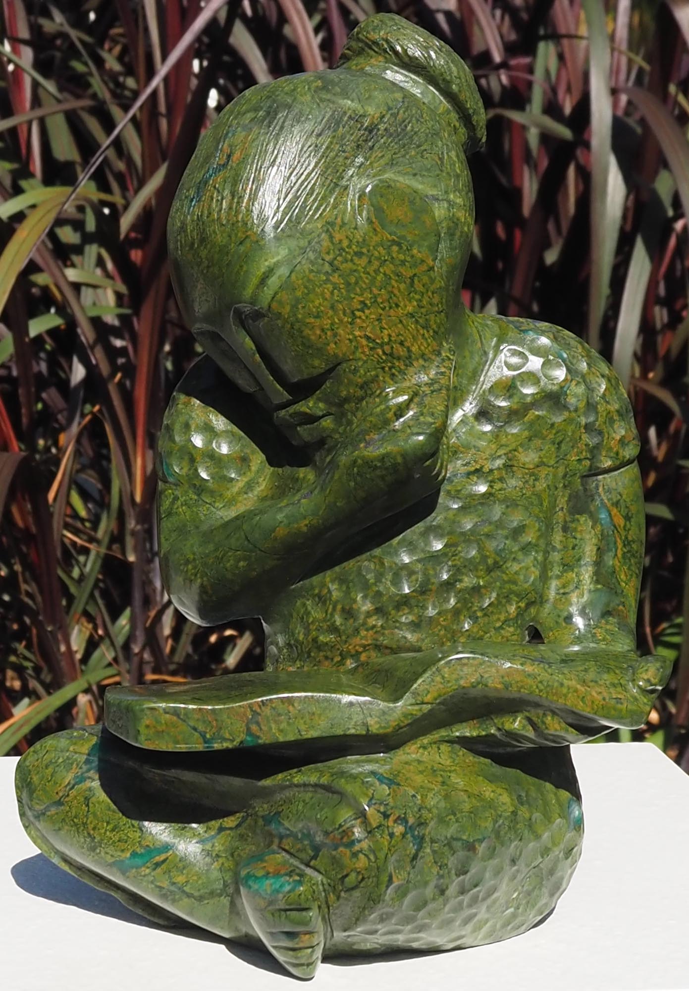 Green stone sculpture child girl book - Joy of Reading by Jonathan Mhondorohuma - front right