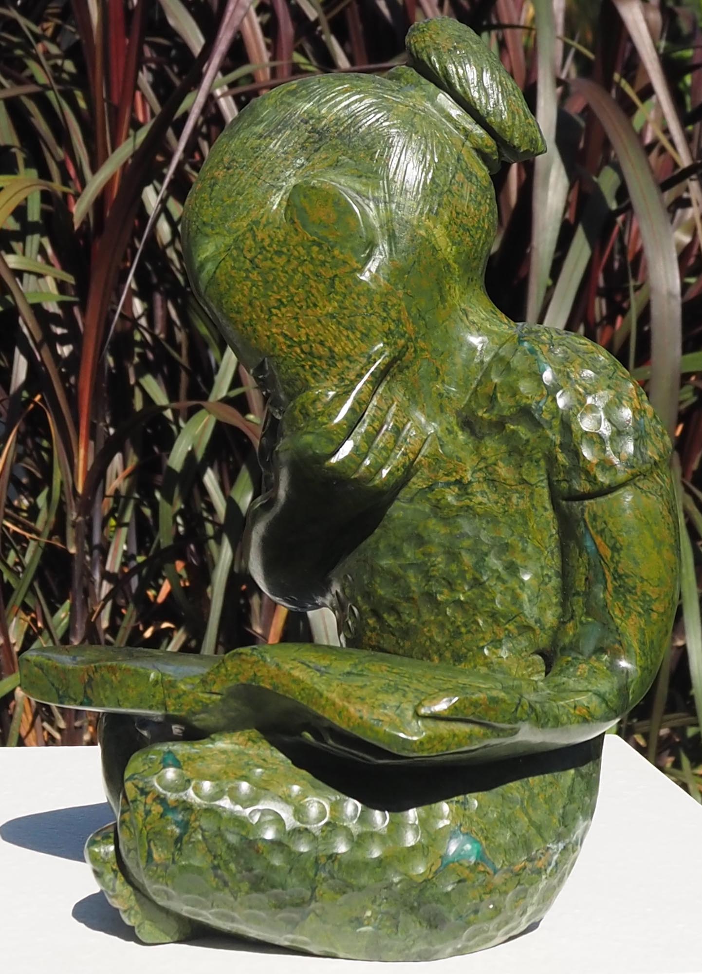 Green stone sculpture child girl book - Joy of Reading by Jonathan Mhondorohuma - right side