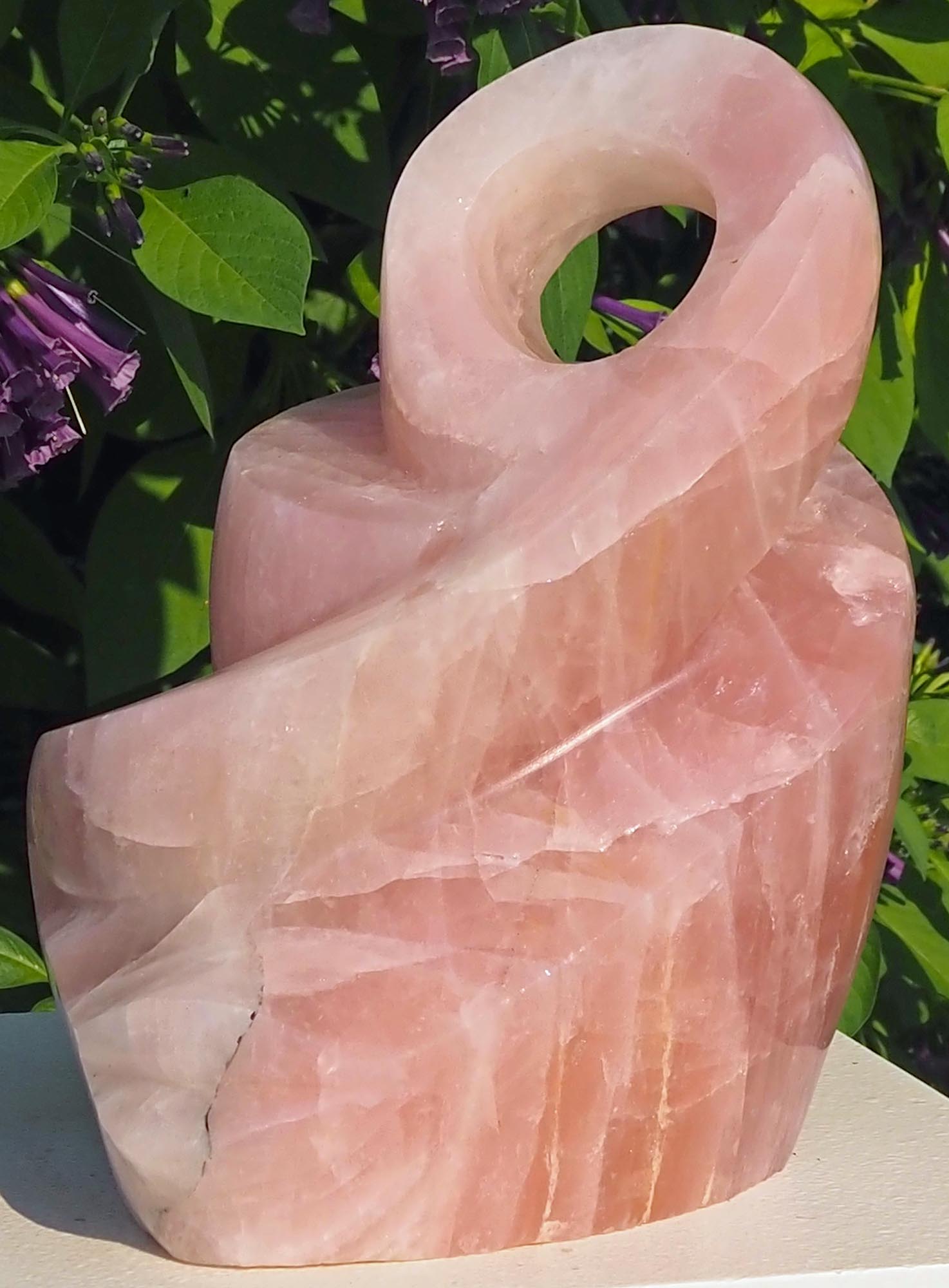 Rose quartz pink stone sculpture art UK - Family Guardian by Tafadzwa Tandi - front right