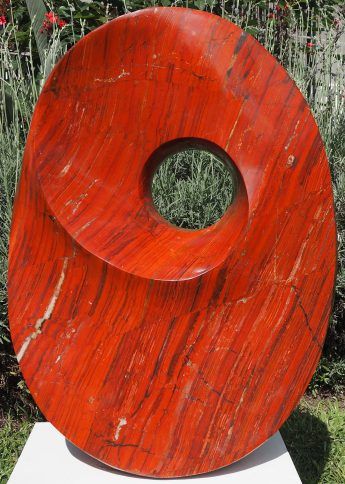 Red jasper stone garden sculpture centrepiece - Karma by Tendai Gwaravaza - front