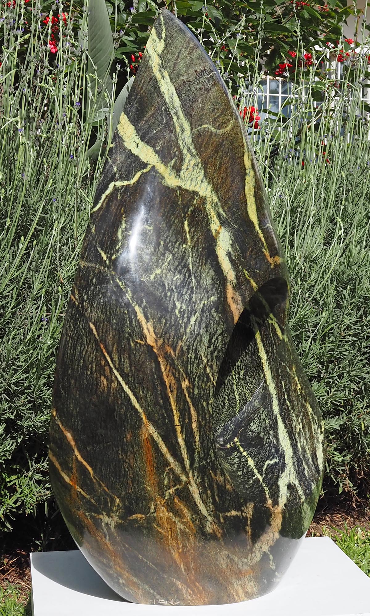 One-off stone garden sculpture centrepiece UK - Healing Herb by Tendai Gwaravaza - back left
