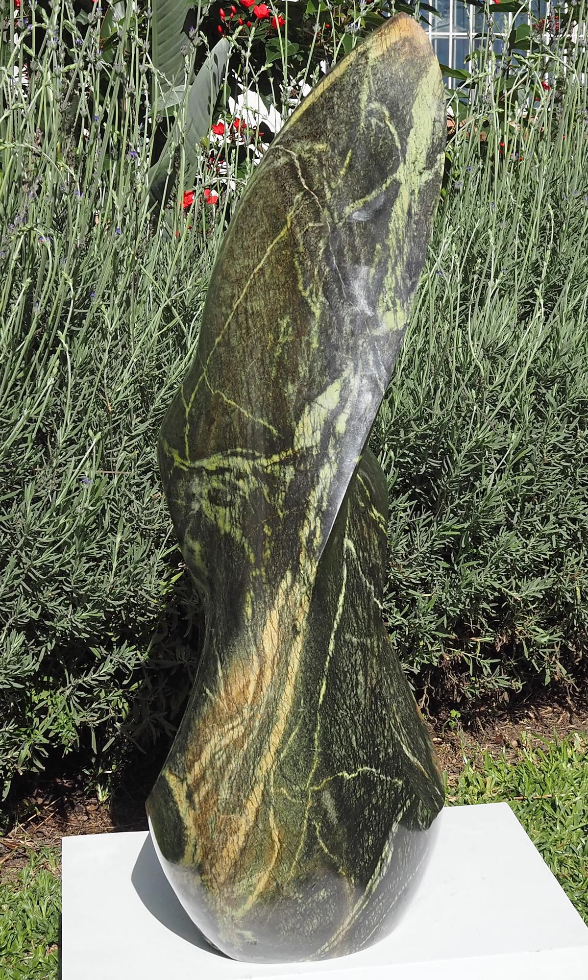 One-off stone garden sculpture centrepiece UK - Healing Herb by Tendai Gwaravaza - left side