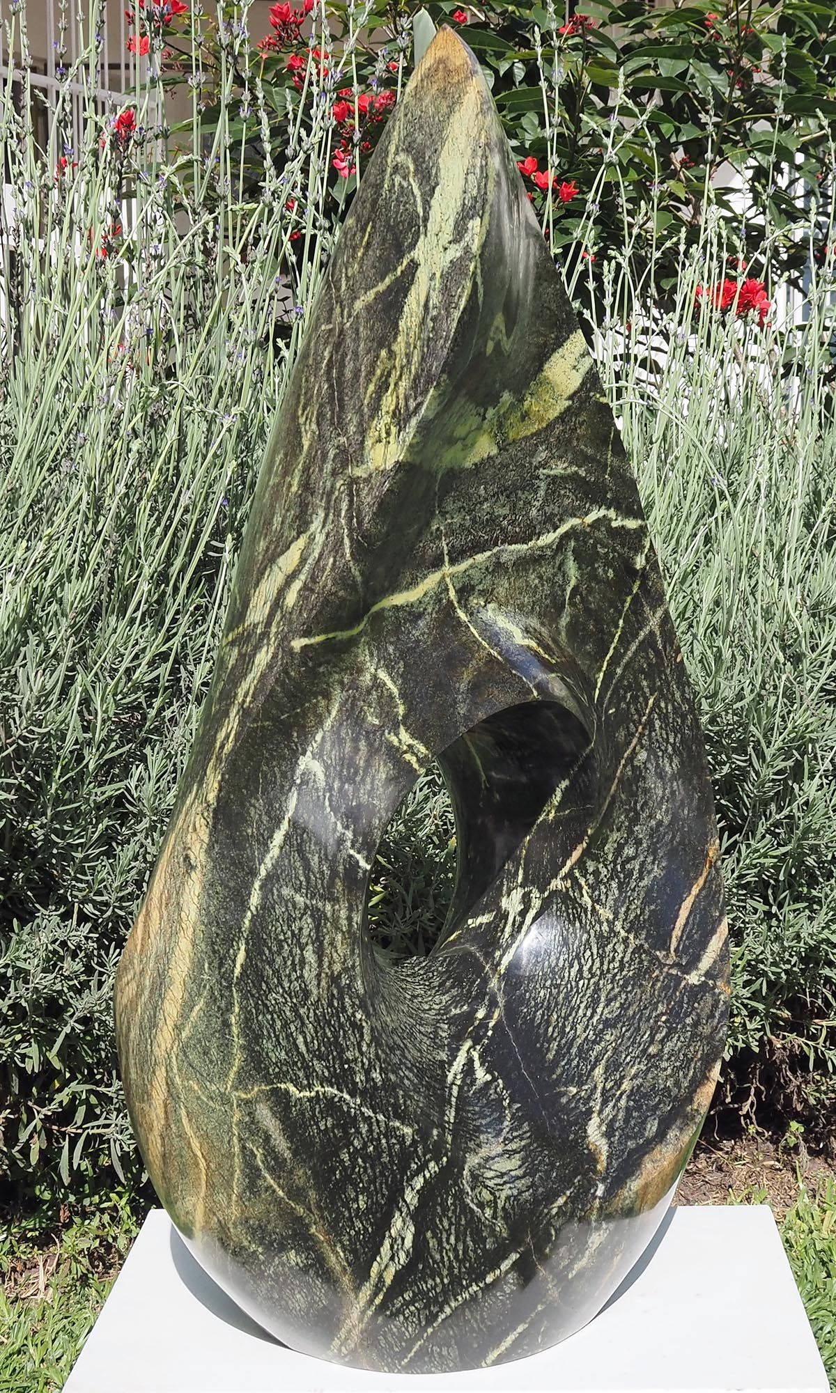 One-off stone garden sculpture centrepiece UK - Healing Herb by Tendai Gwaravaza - front left
