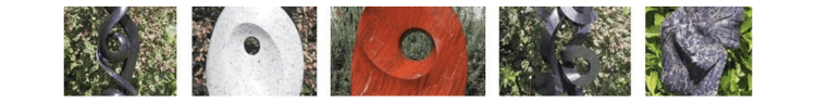 Garden sculptures - selection of stone Shona sculpture in red, white, purple and black stones