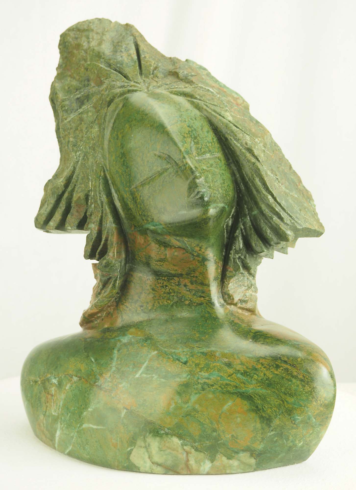 Verdite sculpture from Zimbabwe of a lady's head - Waiting For A Kiss by Tutani Mgabazi - front