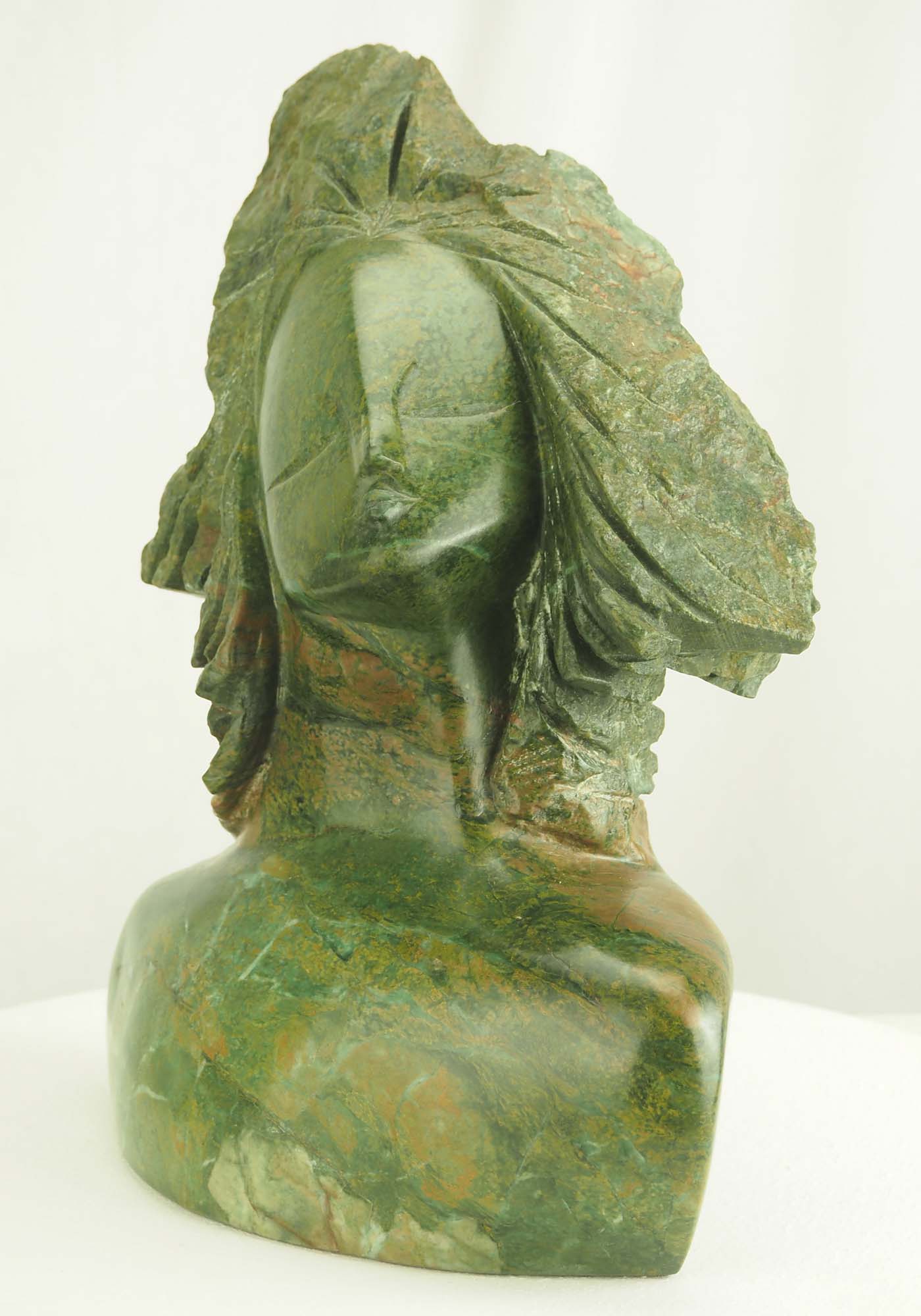 Verdite sculpture from Zimbabwe of a lady's head - Waiting For A Kiss by Tutani Mgabazi - front right