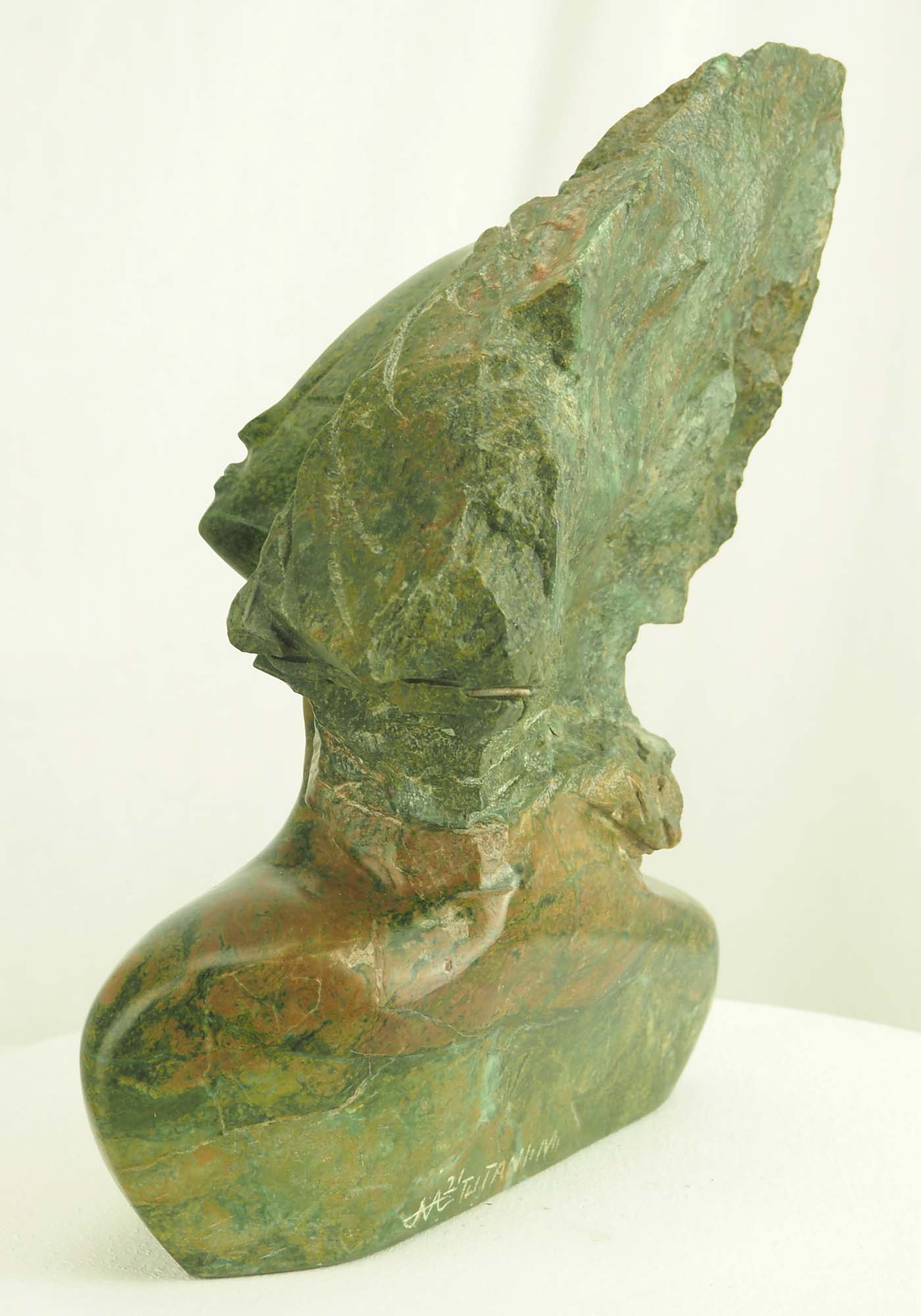 Verdite sculpture from Zimbabwe of a lady's head - Waiting For A Kiss by Tutani Mgabazi - back left